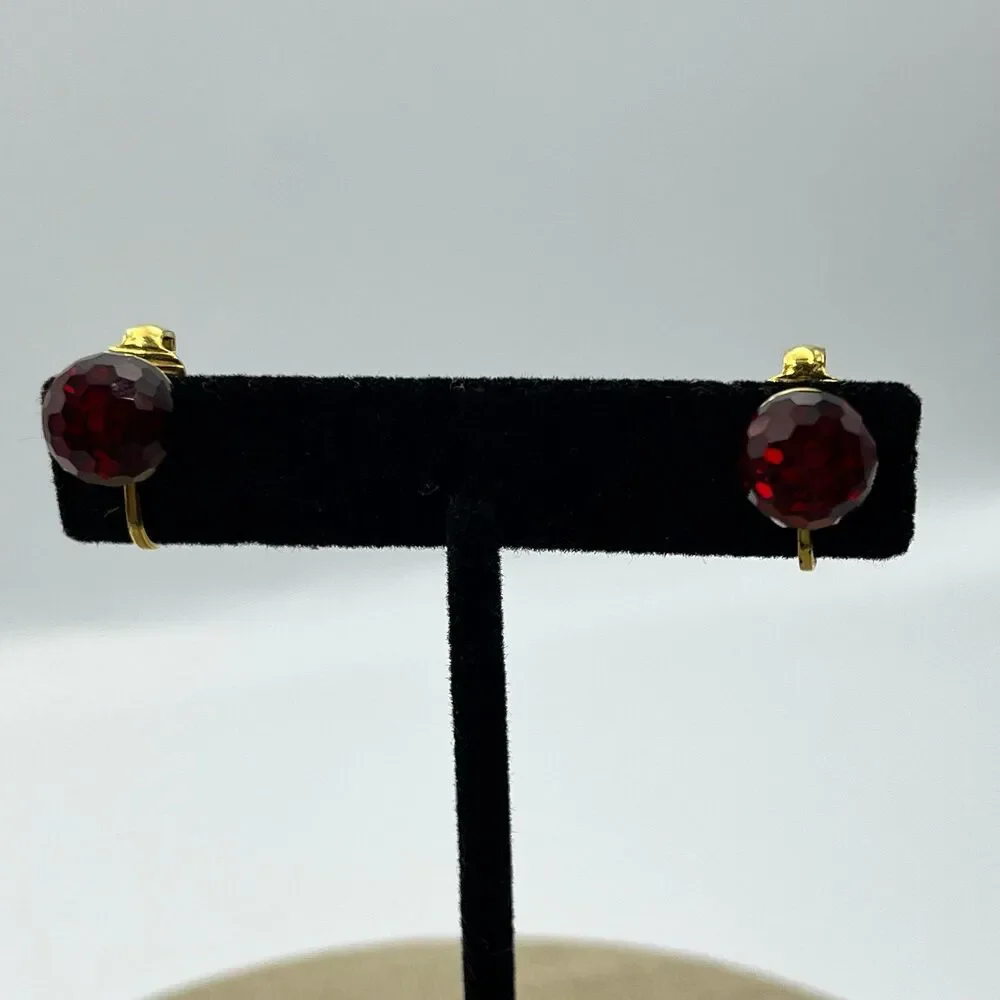 Vintage red glass multi faceted gold tone clip on earrings